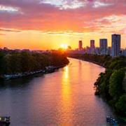 Brisbane River at sunset with city silhouette